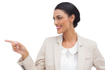 Smiling businesswoman pointing