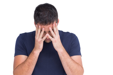 Fototapeta premium Sad man standing with his head in hands