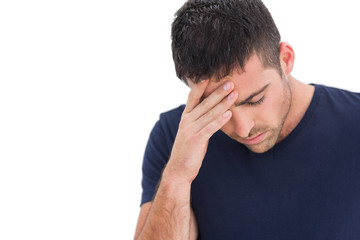 Fototapeta premium Upset man standing with his hand holding his forehead