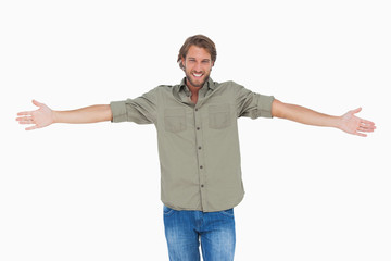 Smiling man with arms open wide