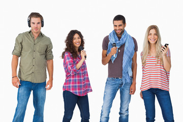 Obraz premium Friends using various types of technology