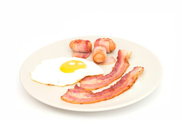 Bacon ham and egg  on dish isolated on white
