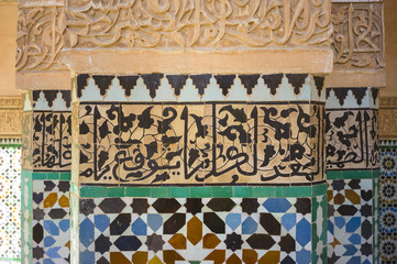 Detail of vivid tiles and calligraphy in mosque, Morocco