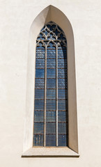 Fototapeta premium Tall Gothic window on church wall in old part of Tallinn