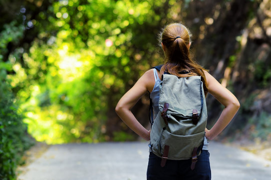 Young woman hiking with backpack