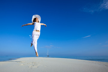 Caucasian woman dancing at the sea