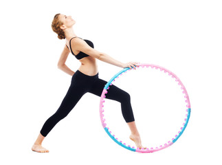 Beautiful sporty woman with hula hoop