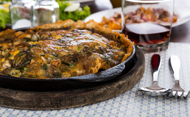 Oysters fried in egg batter  served on iron hot plate