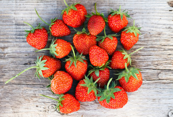 Ripe strawberry on wood