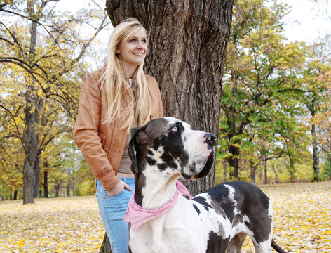 Blond Woman with Dog in the Park