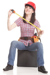 Woman in helmet with a tape measure