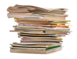 Stack of old magazines isolated on white. Paper recycling