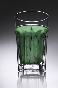 simple water-glass with structured water in green