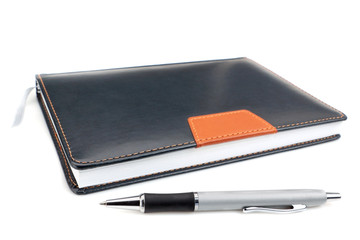 Notebook office organizer and Funky ballpoint pen. On a white ba