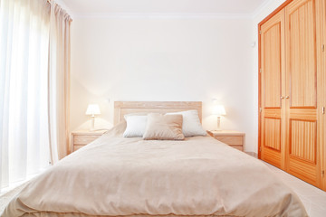 Modern bedroom with new bed. Front view.