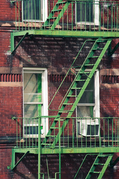 Brick apartment building with stairs in Manhattan, New York. 