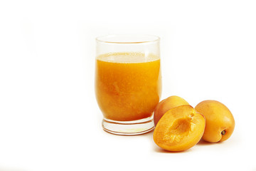 Juice of fresh apricots on a white background