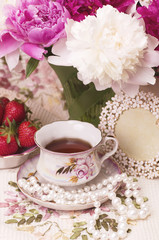 Vintage teacup with spring pi-mesons
