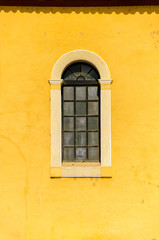 Fototapeta na wymiar Window and Yellow Wall