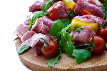 Fresh butcher cut and tomatoes meat assortment garnished