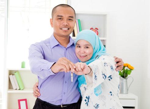 muslim couple showing their house key