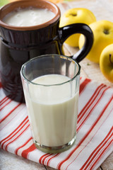 Milk in glass on wooden table