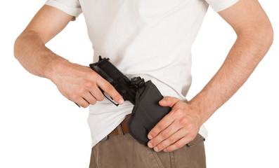 Close-up of a man with holster and a gun