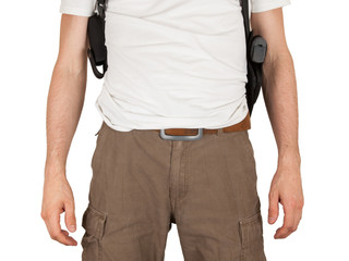 Close-up of a man with holster and a gun