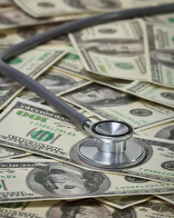 Stethoscope with hypodermic syringe and doze of medical tablets