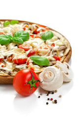 Vegetarian pizza with peppers, mushrooms, tomatoes, olives and b