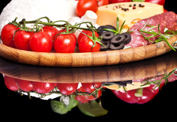 Ingredients for homemade pizza isolated in black