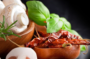 White mushroom with spice in black background