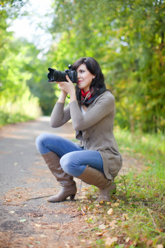   photographer takes photo outdoor