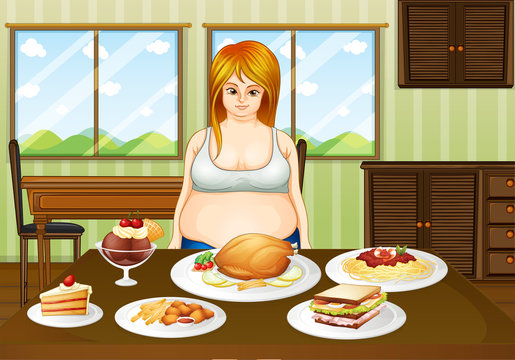 A fat lady standing in front of a table with foods