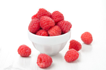 fresh raspberries in a white bowl