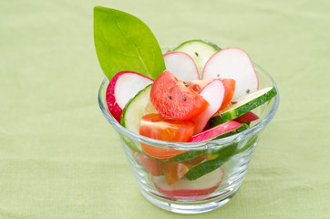 fresh vegetable salad in a glass beaker, horizontal