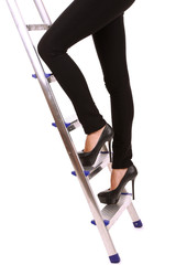 Woman climbing up ladder isolated on white © Africa Studio