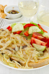 fish with onion and fresh salad