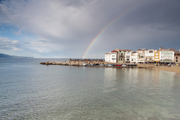 Naklejka na ściany i meble The rainbow over a little fisherman town