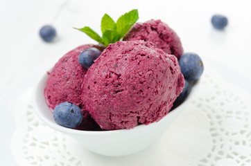 refreshing blueberry sorbet in a white bowl