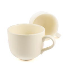 Two ceramic cream colored cups composition