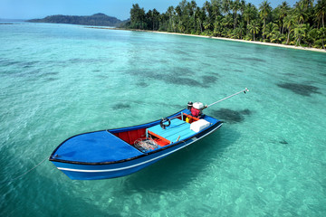 Fototapeta na wymiar Motorboat, beautiful seascape with tropical beach