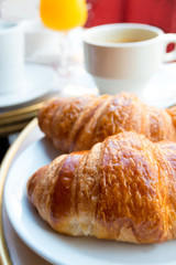 Breakfast with coffee and croissants