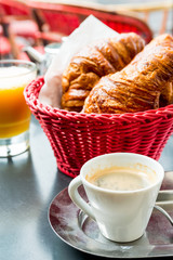 Breakfast with coffee and croissants