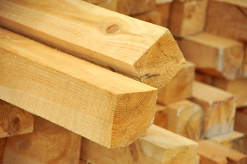 Fresh wooden beam, stacked at construction site