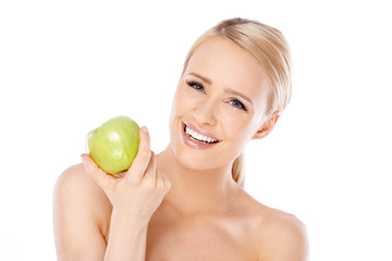 Adorable and healthy woman holding apple