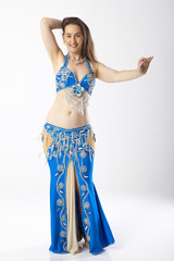 woman with curves dancing an oriental dance belly dancer