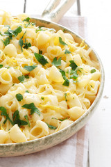 Pasta with cheese, lemon peel and pastry