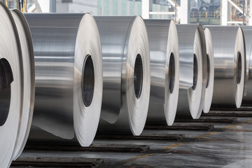 Rolls of aluminum close up in production shop of plant. - obrazy, fototapety, plakaty