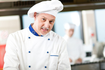 Mature chef in his kitchen